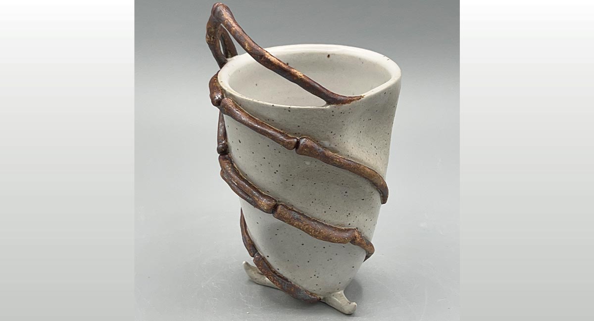 Image of a mug with vines around it