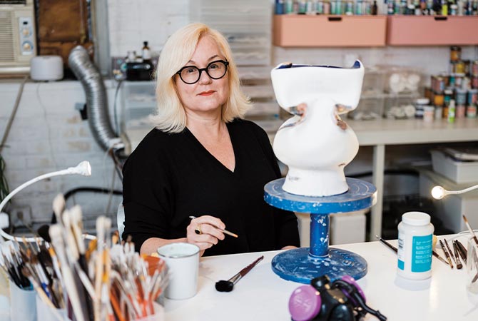 Enlargeable image of an artist working on a ceramic piece