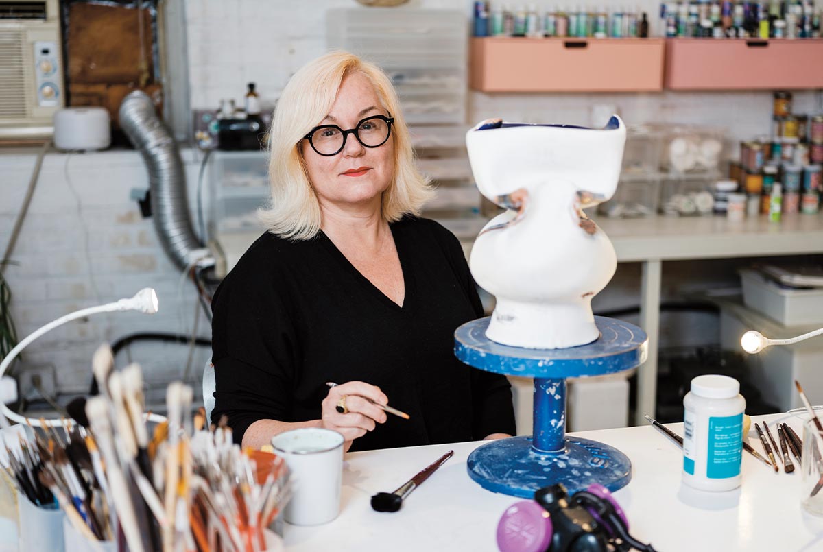 Image of an artist working on a ceramic piece
