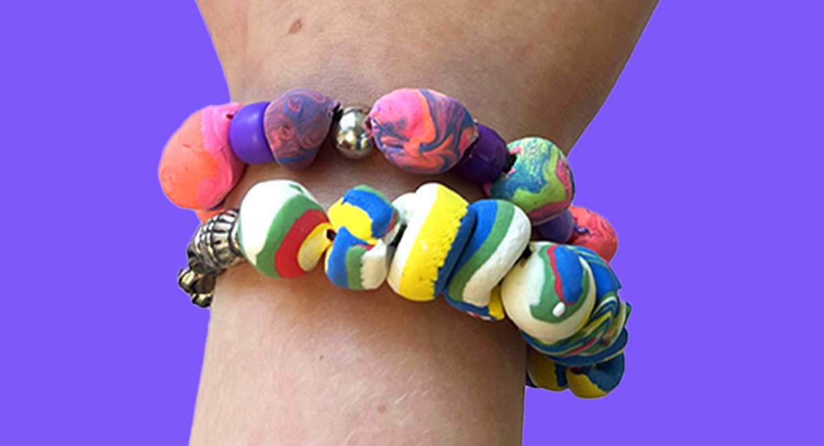 Image of two handmade bracelets on a wrist
