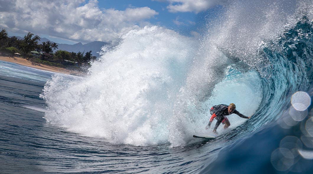 Photo of a surfer riding a wave
